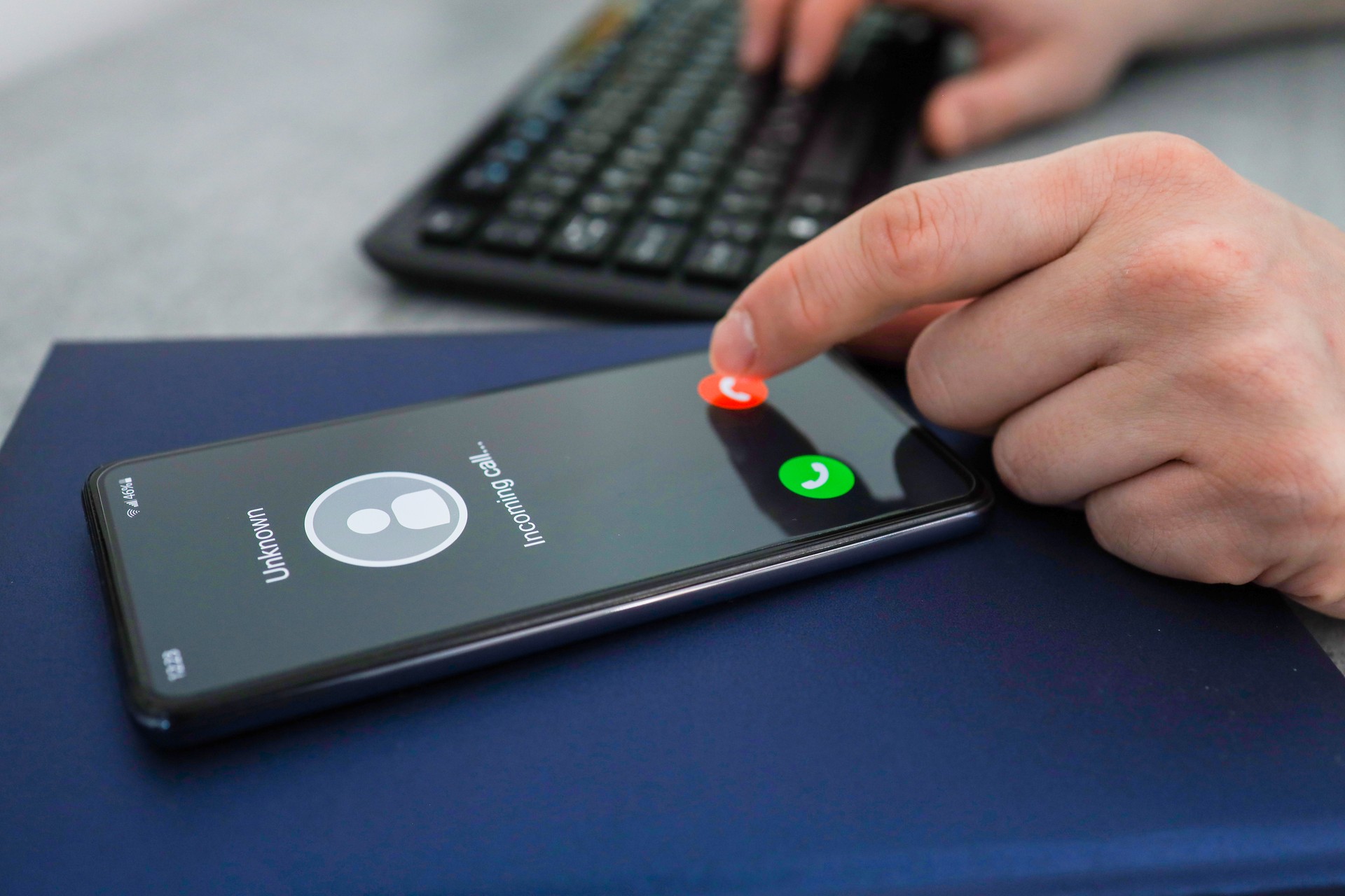 Unknown caller. A man thinks to end the call. Incoming call from an unknown number.
